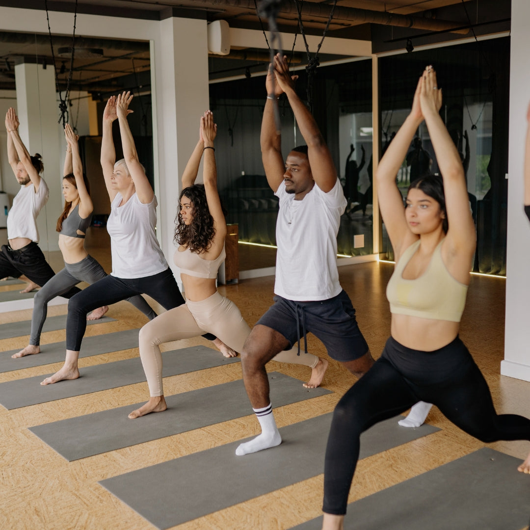 Group of people practicing yoga in a studio